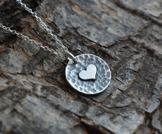 Heart and disc oxidised sterling silver necklace.