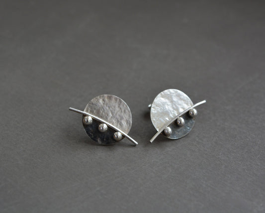 Sterling silver disc stud earrings.