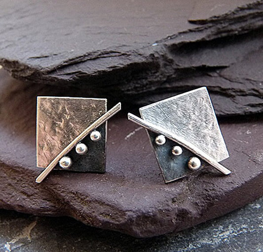 Square stud earrings in sterling silver.