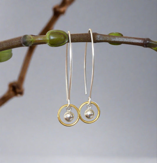 long gold vermeil circle and a silver ball dangle earrings