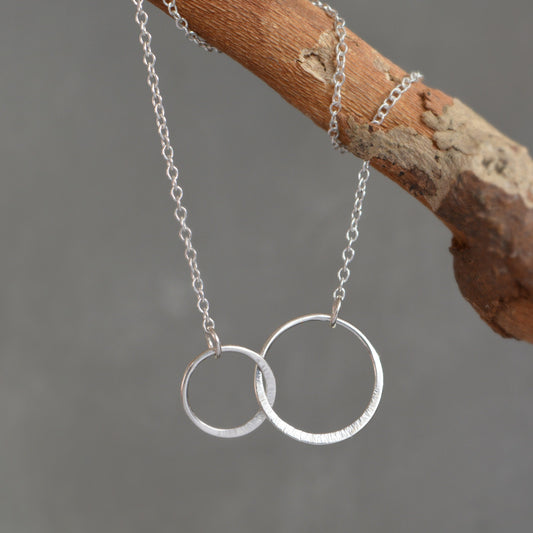 Sterling silver infinity necklace.