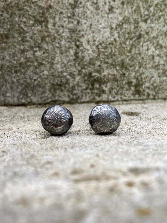 Oxidised sterling silver pebble stud earrings.